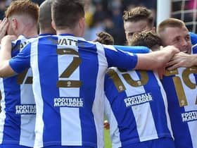 The Latics players celebrate at Lincoln