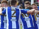 The Latics players celebrate at Lincoln