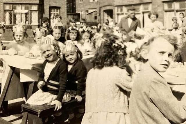 A 1953 coronation street party in Sawley Avenue, Beech Hill. Elaine McCurry's best friend Angela Beatty is nearest to the camera