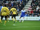 Will Keane shoots for goal against Watford