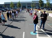 Thousands of shoppers were seen queuing for reopened shops in England