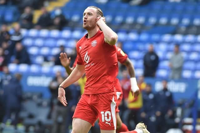 Will Keane celebrates scoring at Bolton