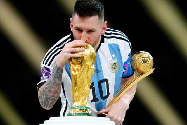 Argentina's Lionel Messi kisses the FIFA World Cup trophy after being presented with the Golden Ball award (Nick Potts/PA Wire)