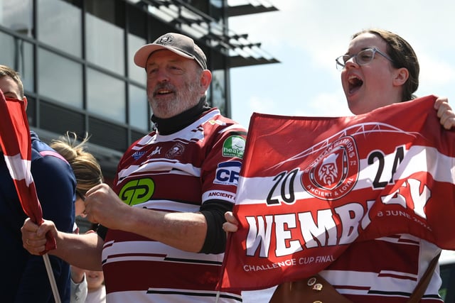 An army of fans dressed in cherry and white gathered at Robin Park Arena to cheer on Wigan Warriors, as they began their journey to Wembley, to take on Warrington Wolves in the Challenge Cup Final at Wembley.