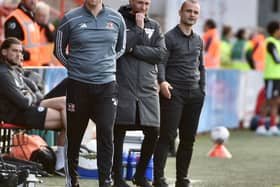 Gary Caldwell and Shaun Maloney share the technical area during Latics' 2-0 victory at Exeter last month