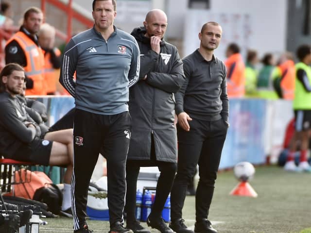 Gary Caldwell and Shaun Maloney share the technical area during Latics' 2-0 victory at Exeter last month