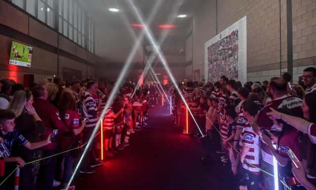 The Wigan Warriors players will walk through the fan village ahead of Sam Powell's testimonial game