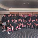Sir Alex Ferguson presented the Wigan players with their Grand Final shirts