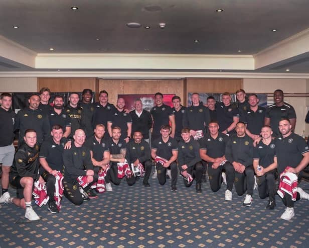 Sir Alex Ferguson presented the Wigan players with their Grand Final shirts