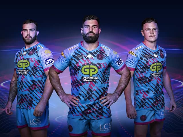 Wigan's Kaide Ellis (left), Abbas Miski (centre) and Jai Field (right) in the new away kit