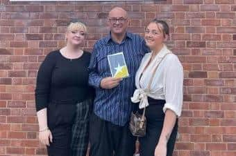 Julie Bramhall's husband Carl and their daughters collected the award