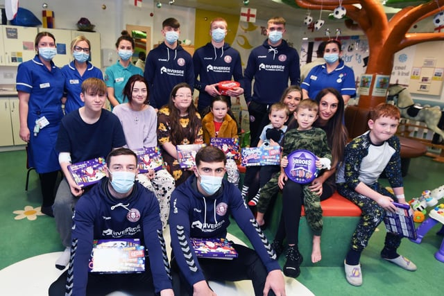 Wigan Warriors players meet staff and visit young patients to give out Christmas selection boxes on the Rainbow Ward at Wigan hospital, Royal Albert Edward Infirmary, Wigan.