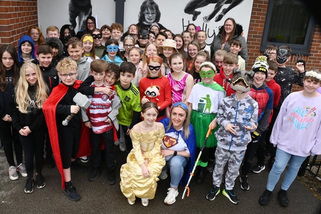 Staff and pupils dressed as superheroes and princesses to remember Holly