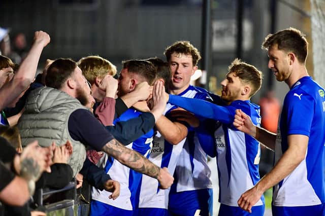 The Latics players celebrate Dale Taylor's penalty at Exeter with the away end
