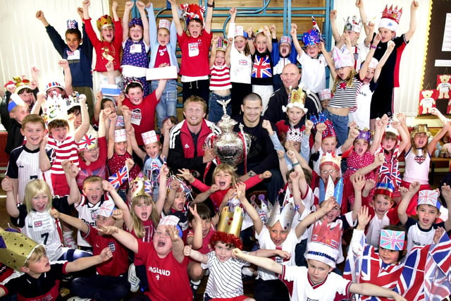Cup of cheer for pupils at St. Bernadettes RC Primary School, Shevington, when Andy Farrell, Denis Betts and Mike Gregory brought the recently won Rugby League Challenge Cup to their Queens Golden Jubilee party on Thursday 30th of May 2002.