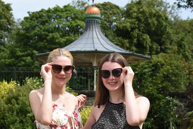 Rachel Hiney and Francesca Mitchell enjoy the sunshine at Mesnes Park, Wigan.