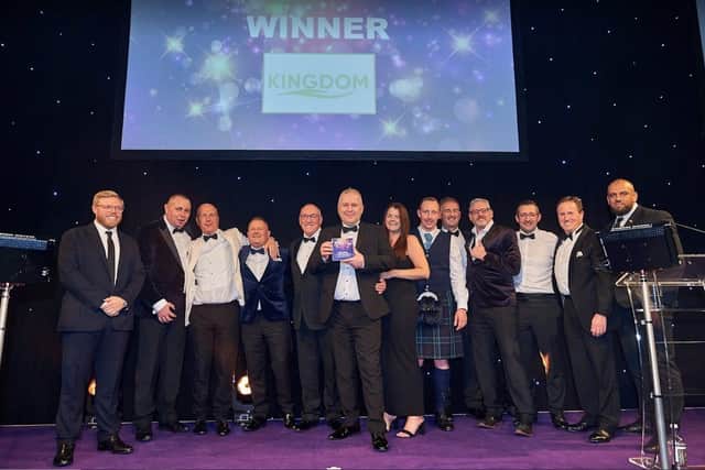 Kingdom Security celebrates its award with comedian Rob Beckett (left)