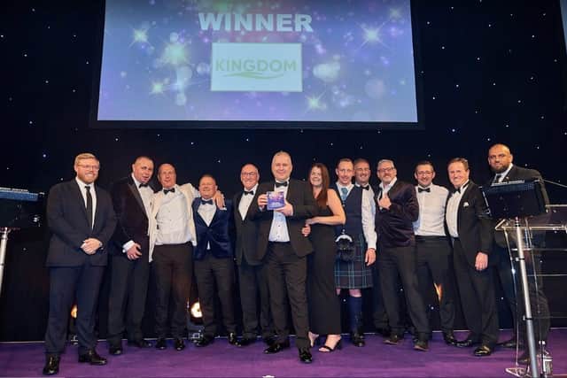 Kingdom Security celebrates its award with comedian Rob Beckett (left)