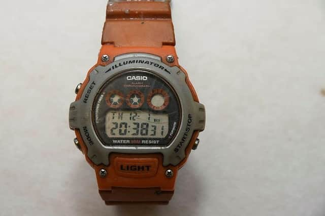 The distinctive orange coloured Casio digital watch the man was wearing