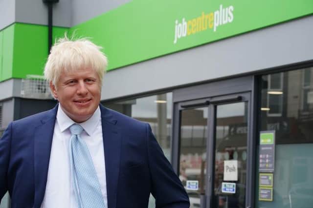 A wax figure of Boris Johnson appeared outside a job centre in Blackpool (Credit: PA Media)