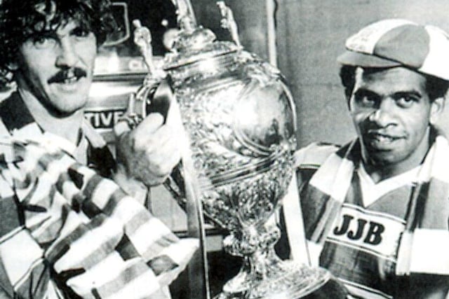 Brett Kenny and John Ferguson show off the Challenge Cup in 1985, which was the first trophy under Maurice Lindsay's leadership as Wigan chairman.