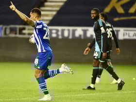 Josh Magennis celebrates the first of his hat-trick for Latics in the 7-1 thrashing of Leicester City Under-21s
