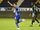Josh Magennis celebrates the first of his hat-trick for Latics in the 7-1 thrashing of Leicester City Under-21s