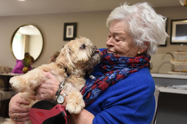 Resident Anne Scholes and her dog Ollie.