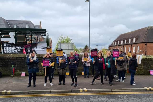Striking nurses outside Wigan Infirmary today