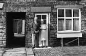 Peter and Mary Ashcroft outside their 100 year old cottage in Townsends Yard, off St. James Road, Orrell, in October 1971.