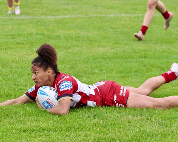 Tiana Power scoring a try for Wigan Warriors Women