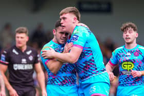 Wigan’s Harvie Hill celebrates his try with team-mate Tom Forber