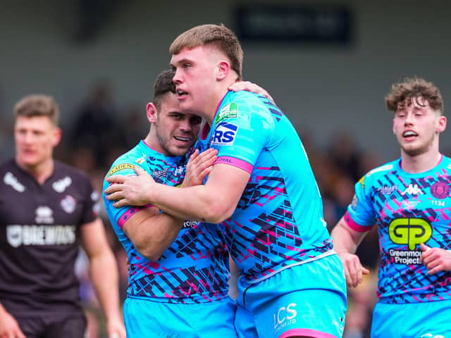 Wigan’s Harvie Hill celebrates his try with team-mate Tom Forber