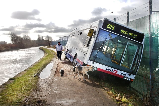 A stolen bus lies tilted into a ditch alongside the Leeds and Liverpool canal near the B&Q store.  Yobs had stolen the vehicle from the First Bus depot in Melverley Street in the early hours of Thursday 12th of March 2009 and driven it down the nearby Seven Stars Road and onto the towpath where it became stuck in the ditch. The sign on the front had been set as the 625 to Beech Hill and the bus was pointing in the right direction for that destination.  It took 10 hours before a specialist winch was able to drag the badly damaged bus backwards along the towpath and onto the road.