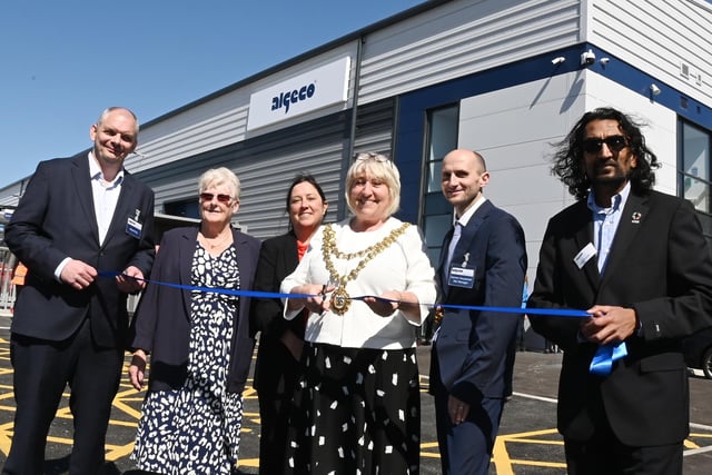 The Mayor of Wigan Coun Marie Morgan, centre, cuts the ribbon to officially open Algeco, Europe's leading modular and offsite building solutions brand, on the former site of Morrisons supermarket, Ince, Wigan.