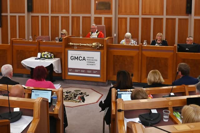 Coun Anderson takes his mayoral seat in the Wigan Council Chamber.