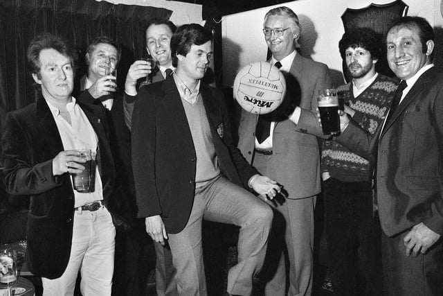 Football star Duncan McKenzie who played for Notts Forest, Leeds, Everton, Chelsea and Blackburn pictured with officials when he opened the new club house at Garswood United on Monday 21st of February 1983.