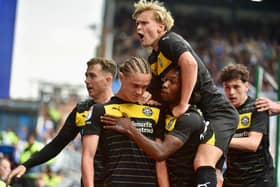 Thelo Aasgaard is mobbed after levelling the scores at Birmingham