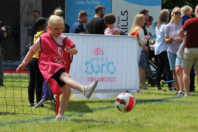 Family fun at children and adults take part in the interactive workshops at the Women's Euro 2022 Roadshow, held at Mesnes Park, Wigan.