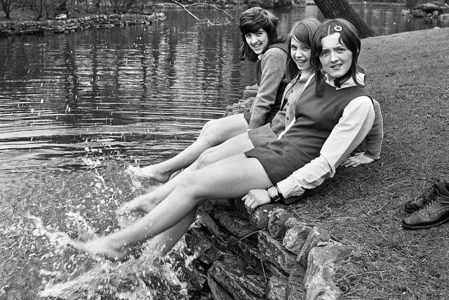Young schoolgirls Lorraine Ridyard, Christine Woods and Denise Sinclair splashing in the duck pond on a mild Spring day in Mesnes Park on Monday 20th of March 1972.