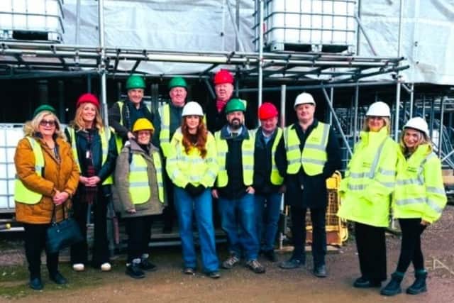 Members of Wigan's scrutiny committee at Haigh Hall following their journey by public transport