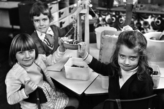 Caroline Smith, Timothy Gleave and Sherri McGrae weighing things up at Evans County Infants School, Ashton, in October 1976.