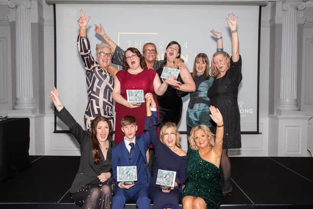 Belong Atherton and Belong Wigan winners celebrate their Champion Awards.