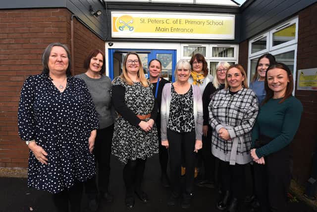 A team of teaching assistants at St Peter's C of E primary school, Hindley, celebrate as the school has been awarded the Best Practice for Teaching Assitants award creditation.