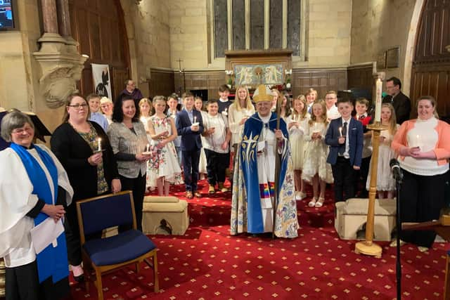 Bishop of Blackburn, Rt Rev Julian Henderson, confirming 23 candidates into the Church of England at Christ Church, Parbold