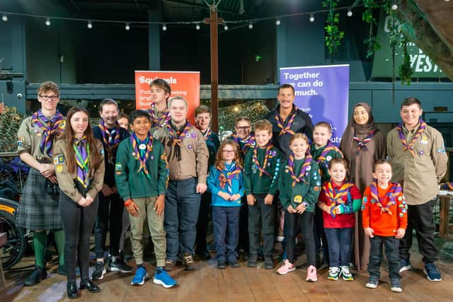 Bear Grylls with his award winners including Ella (centre front)