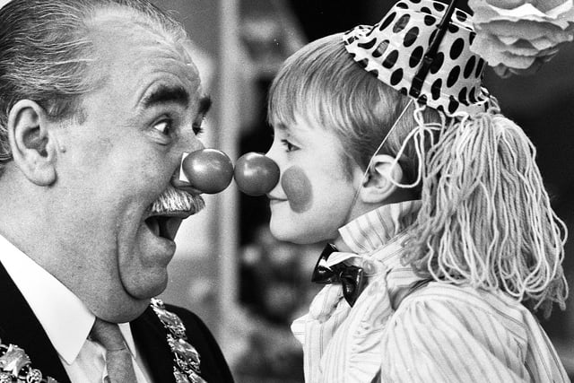 Nice to nose you! Wigan mayor Councillor Jimmy Jones comes face to face with 5 year old Gary Edwards at Wood Fold Primary School, Standish, for Red Nose Day in aid of Comic Relief on Friday 5th of February 1988.