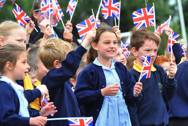 WIGAN - 27-05-22
Year Six pupils at Nicole Mere Primary School, Ashton-in-Makerfield, take part in the Trooping of the Colours parade, in front of staff and pupils waving flags, to end a week of celebrations for the Queen's platinum jubilee.