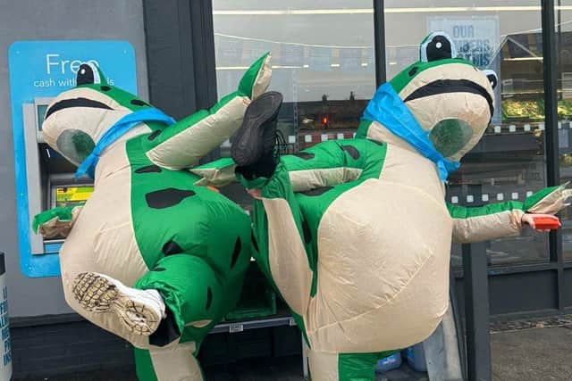 Maddie Doran, 16, and 15-year-old Eva Wilkinson ran four miles from Standish to Orrell wearing huge inflatable frog costumes.