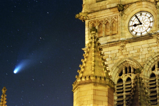 The Hale-Bopp comet in the night sky over Wigan Parish Church on Sunday 30th of March 1997.
